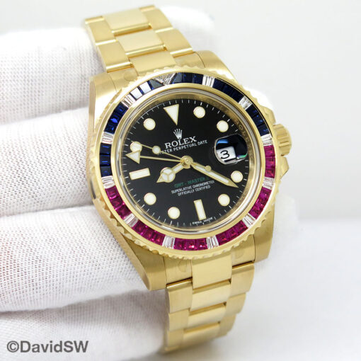 Rolex 116748SARU GMT Master II 18K Yellow Gold with Ruby/Sapphire Bezel (New Old Stock)